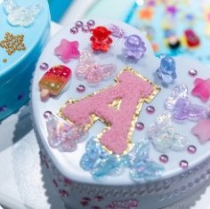 Box decorated with creamy glue and sprinkles