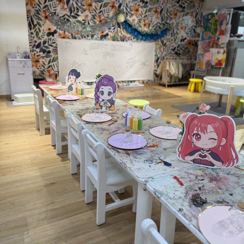 K-pop Demon Hunters party table with character cut-outs